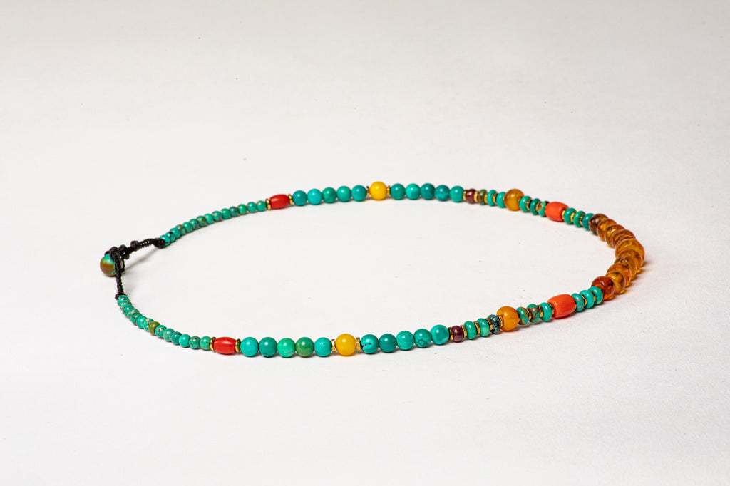 Turquoise necklace with Amber center