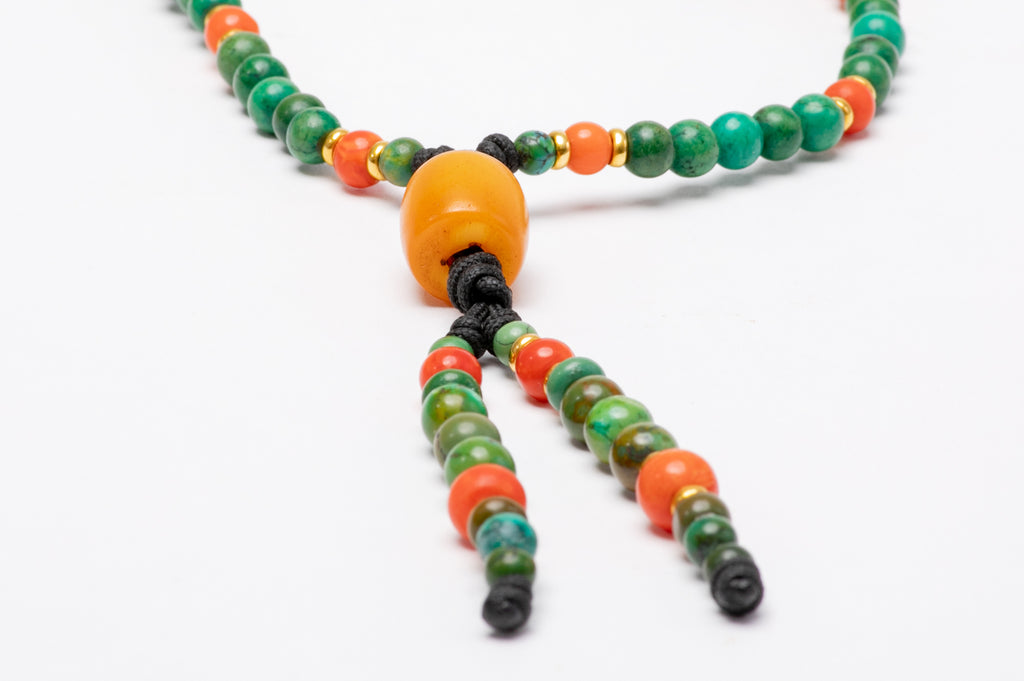 flower carved amber stone with gold beads mala necklace