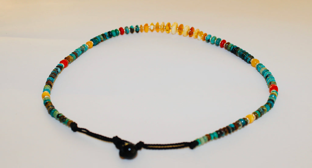 Turquoise necklace with milky Amber center